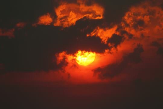 Sun, smoke and clouds. Image - Ed Dunens, flickr