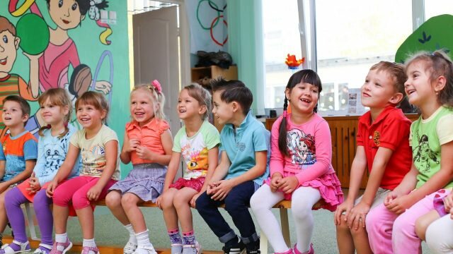 children sitting in a row kid future threats climate change sustainability sugar food obesity